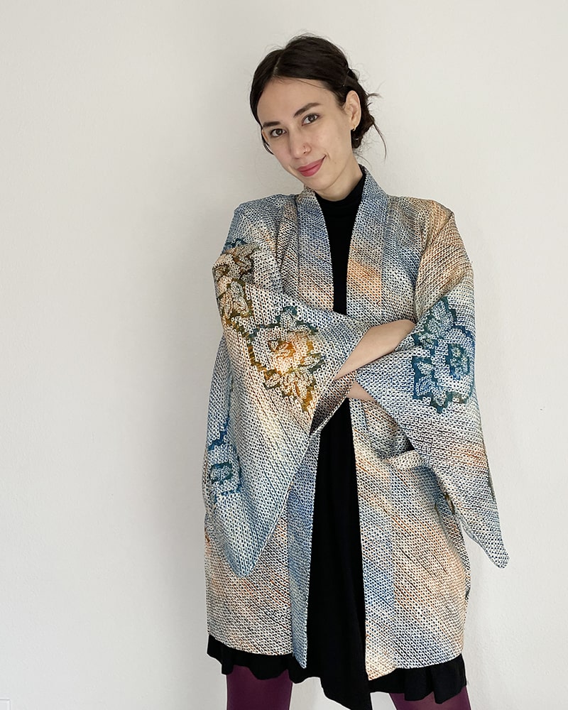 Woman wearing Kimono zen brand Blue Blossom Shibori Haori Kimono Jacket with black dress and purple tights