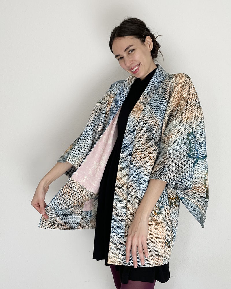 Woman wearing Kimono zen brand Blue Blossom Shibori Haori Kimono Jacket with black dress and purple tights