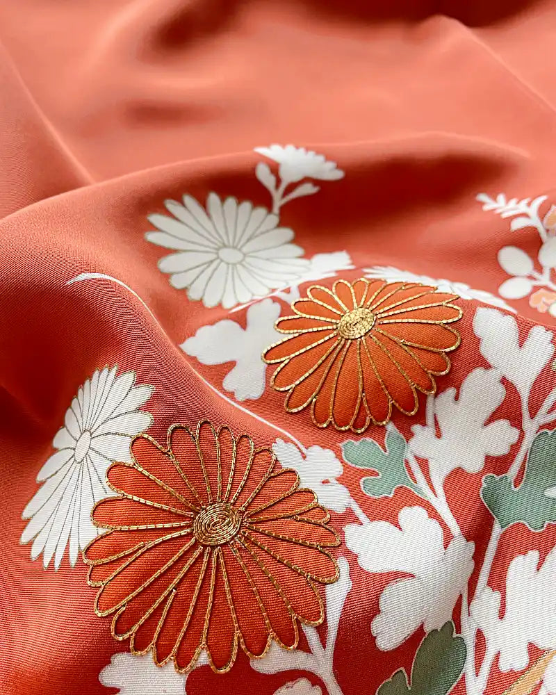 Gold Embroidered Chrysanthemum close up fabric photo.