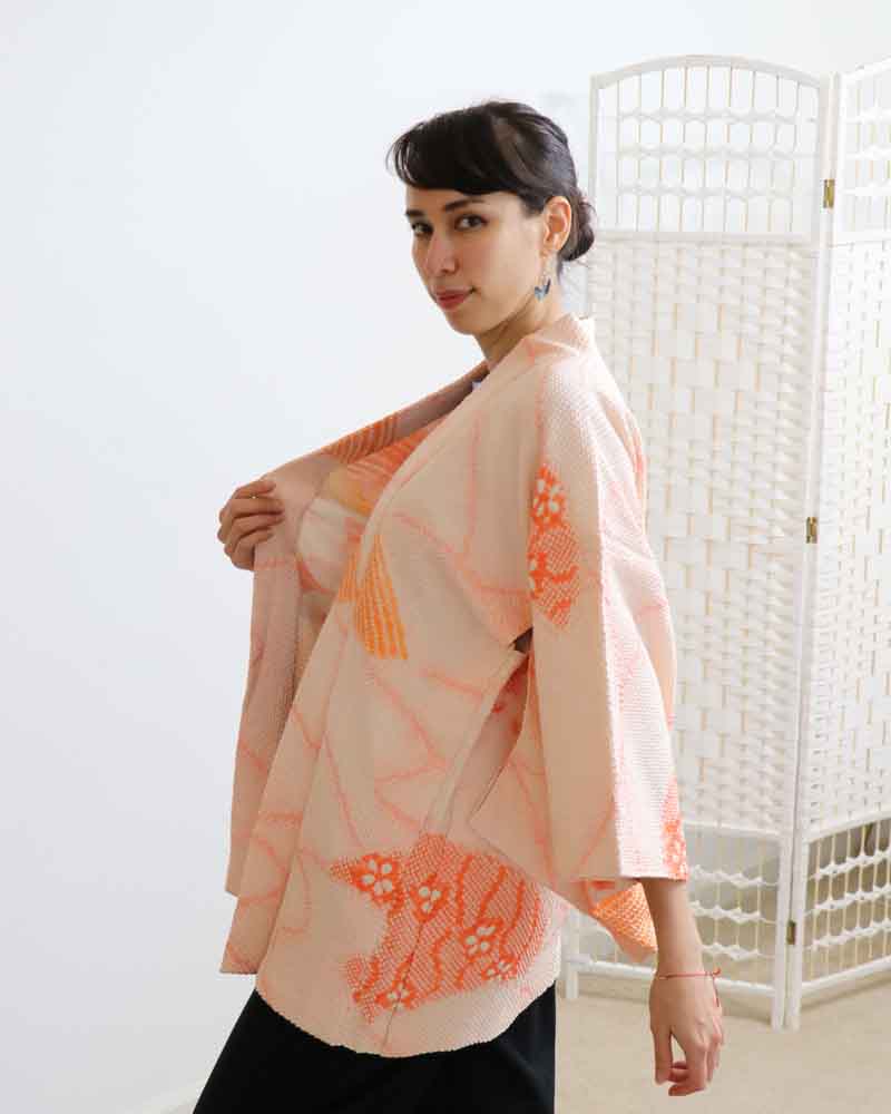 Photo of  a woman opening the kimono.
