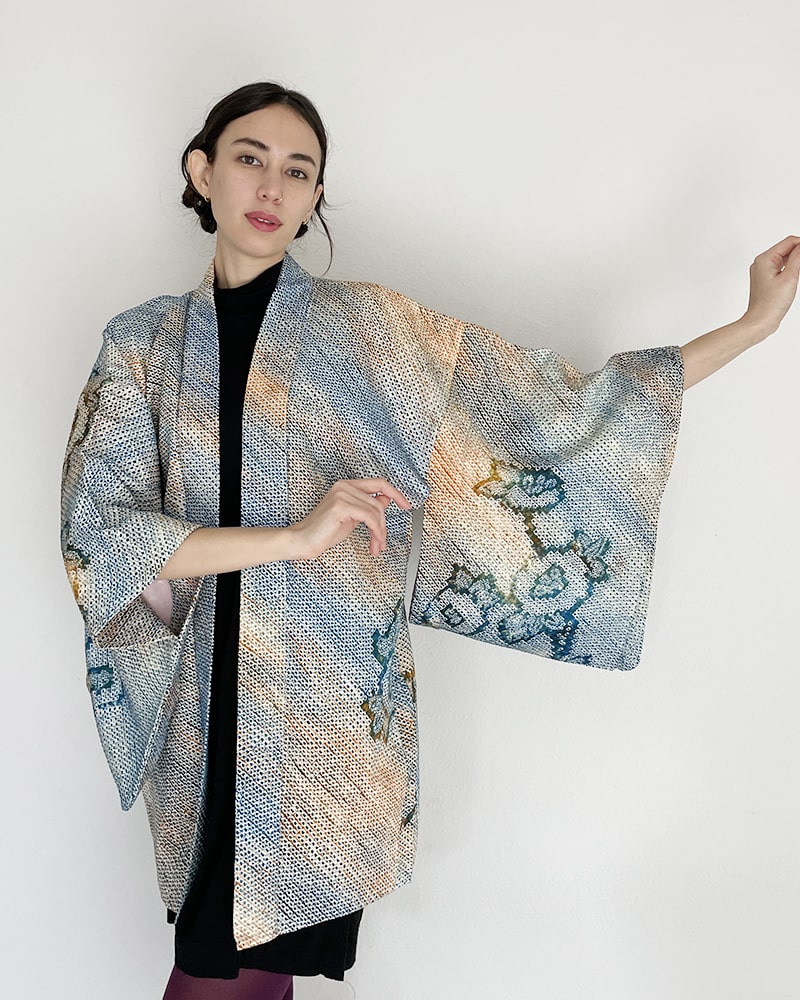 Woman wearing Kimono zen brand Blue Blossom Shibori Haori Kimono Jacket with black dress and purple tights