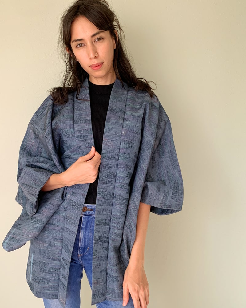 Woman wearing Kimono zen brand Blue Tsumugi Haori Kimono Jacket with black T-shirt and jeans