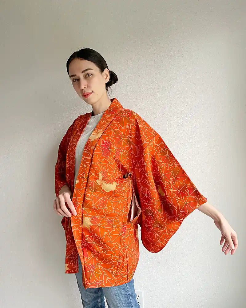 Woman wearing burnt orange haori jacket