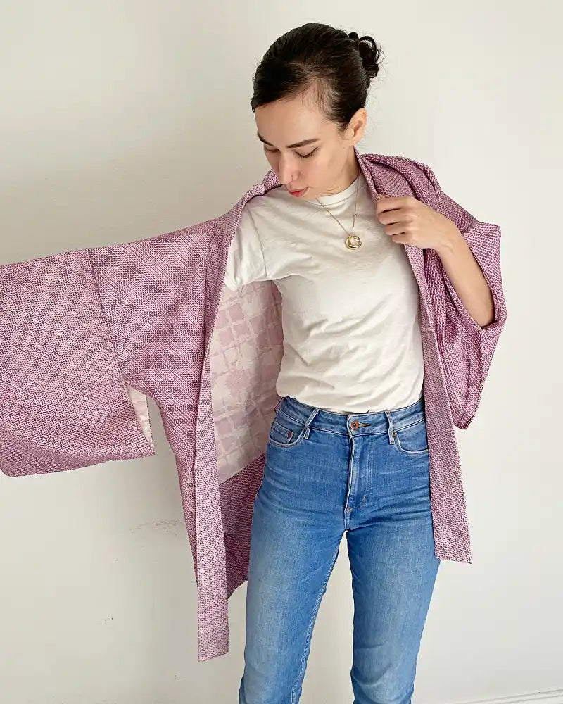 Woman is wearing light purple colored shibori jacket